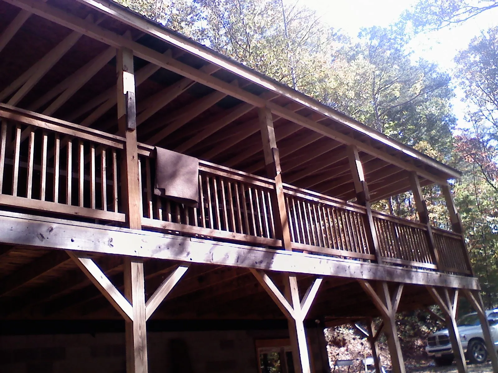 Timber framing under a new elevated porch and deck — Roof Leak Repair in Longmont by Roofing Brothers